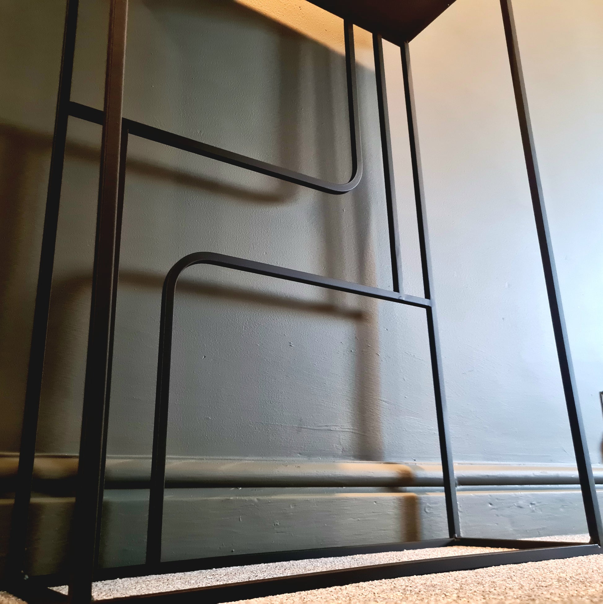 Metallic chair frame with a neutral background